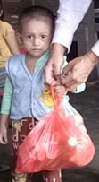 Little child with bag of food